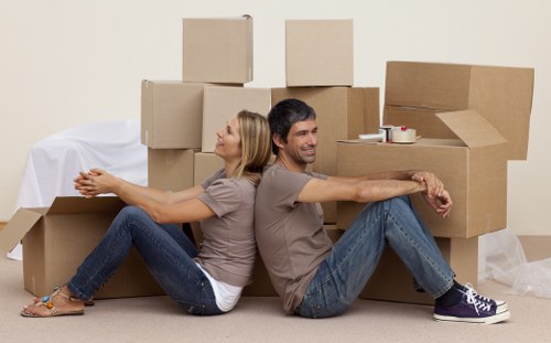 Packed boxes and furniture loaded into a removal van