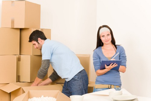 Packed boxes and furniture ready for local removal service