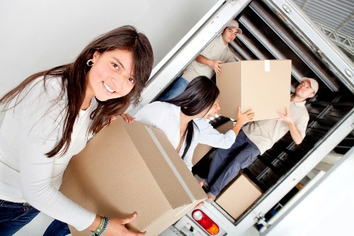 Local removals team handling furniture delivery and unloading