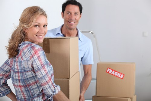 Local removal team handling furniture and boxes during a move